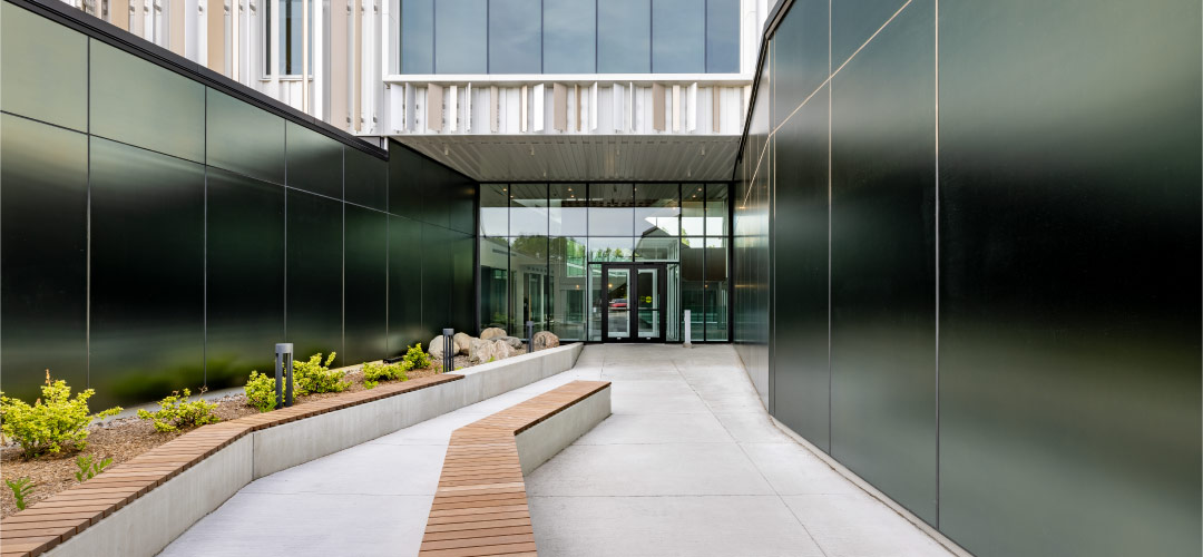 Walker Textures Satinlite acid etched glass provides a matte mirrored effect at the Terrebonne Police Headquarters